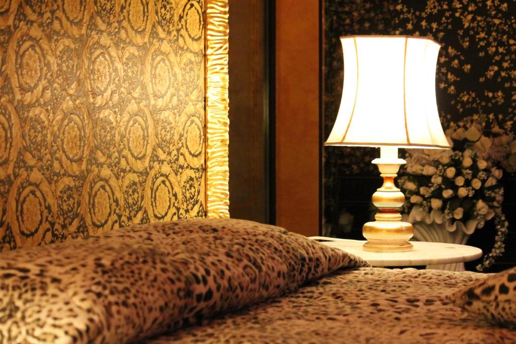 Postel nebo postele na pokoji v ubytování Hotel Parco dei Principi
