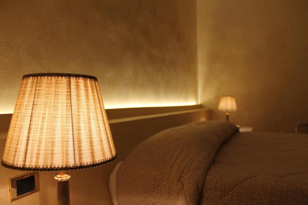 Postel nebo postele na pokoji v ubytování Hotel Parco dei Principi