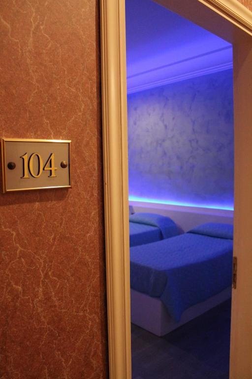 Postel nebo postele na pokoji v ubytování Hotel Parco dei Principi