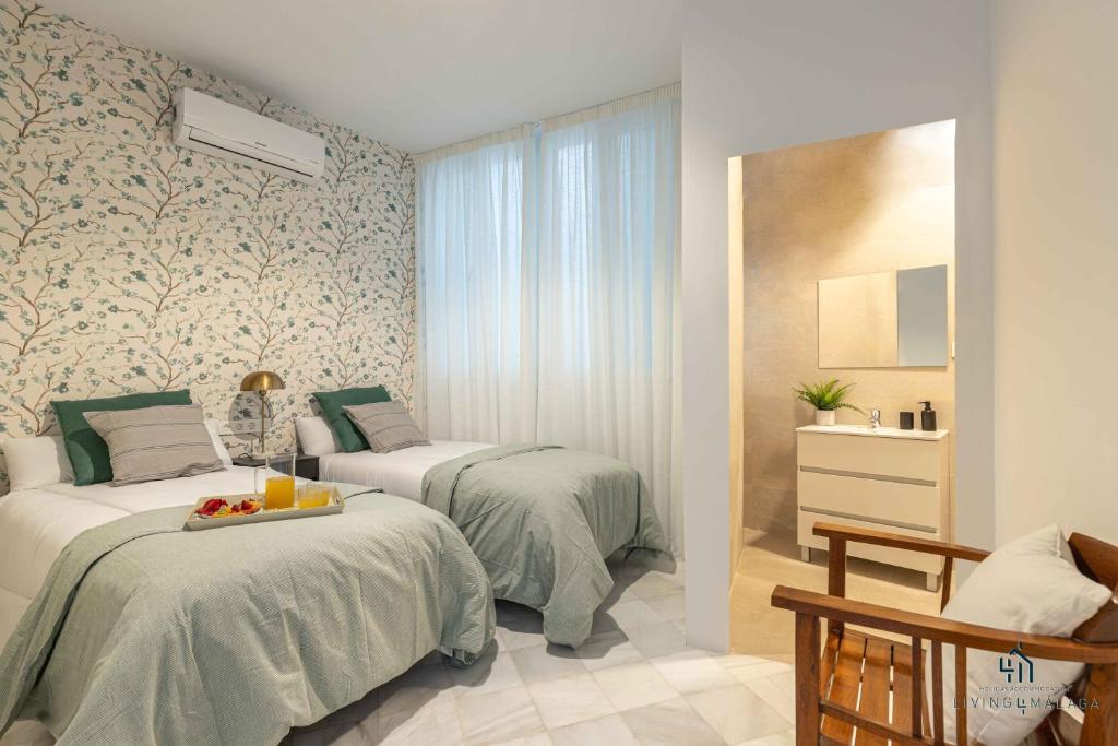 Postel nebo postele na pokoji v ubytování Living4Malaga Stylish Monroy