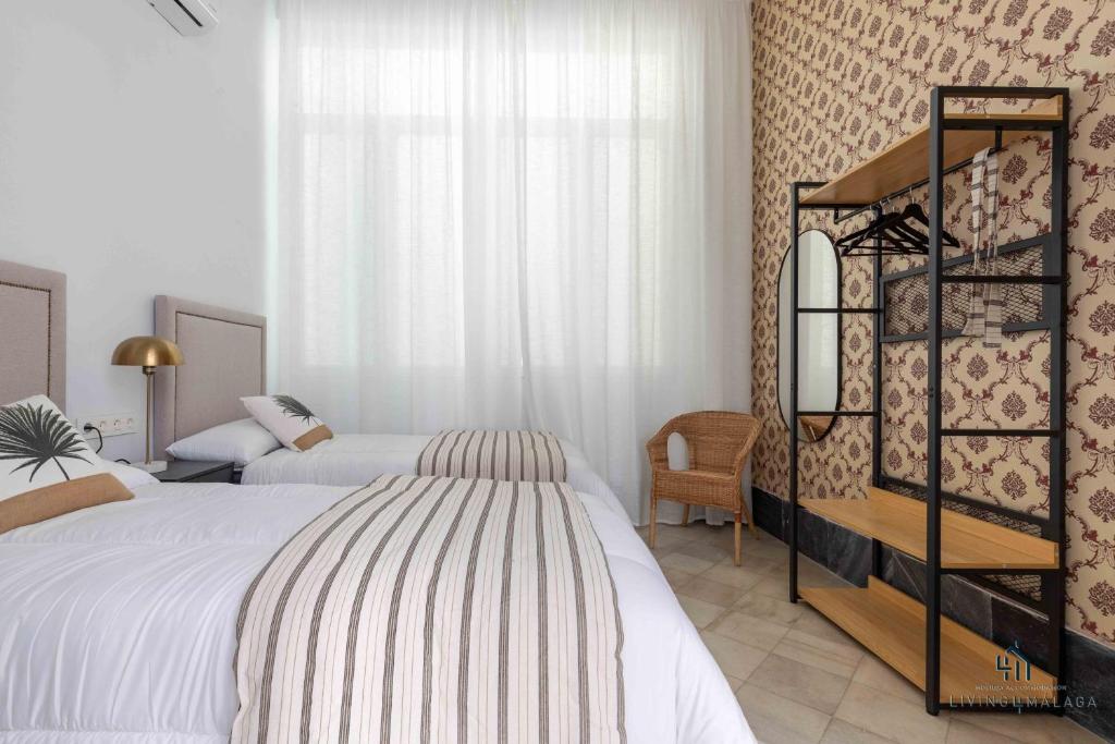 Postel nebo postele na pokoji v ubytování Living4Malaga Stylish Monroy