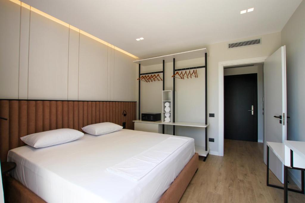 Postel nebo postele na pokoji v ubytování Meraviglia Boutique Hotel