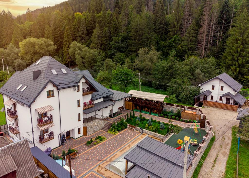 an aerial view of a house with a yard at GORHouse Hotel in Yaremche