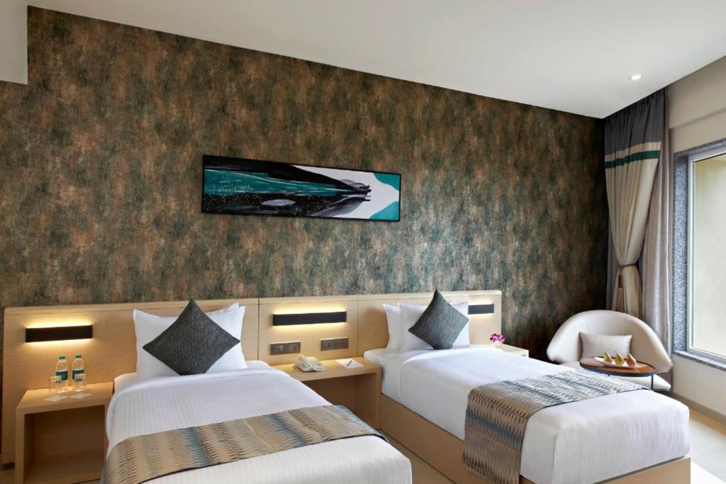 Postel nebo postele na pokoji v ubytování Click Hotel Bangalore - International Airport