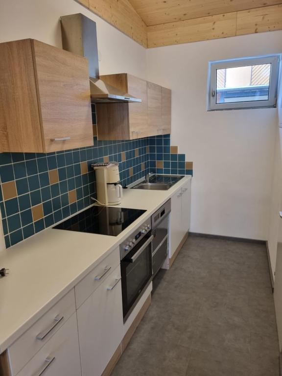 Kuchyň nebo kuchyňský kout v ubytování Appartementhotel Rutar Lido