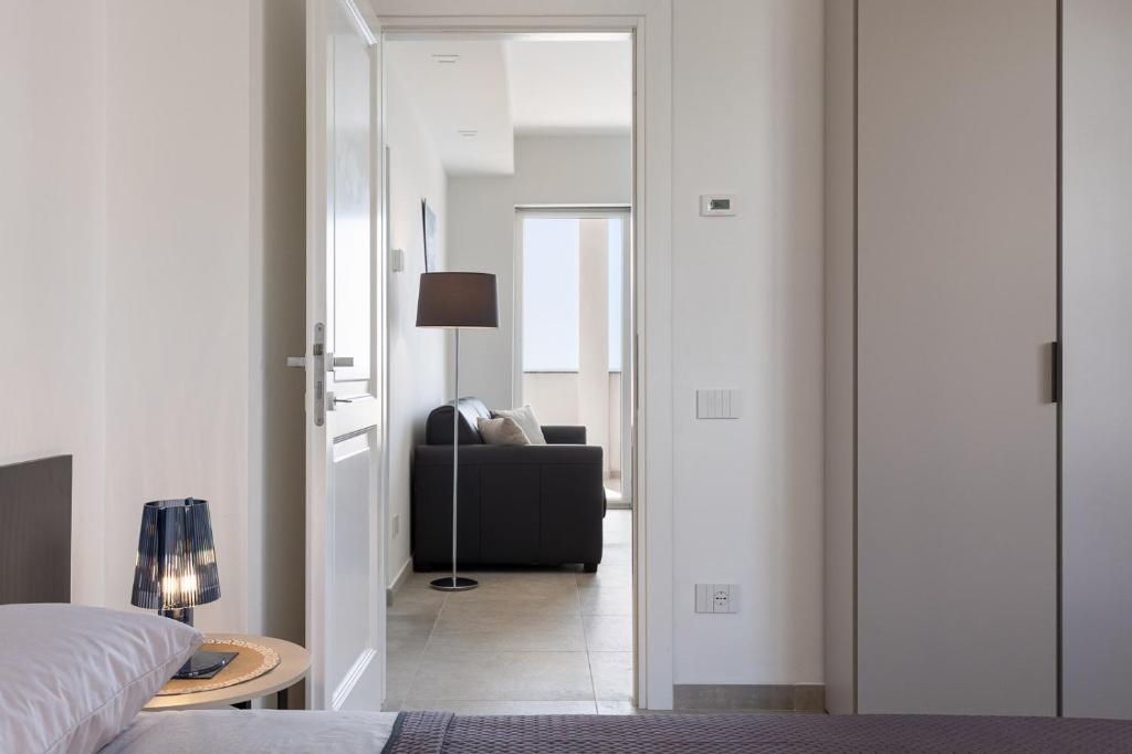 Posteľ alebo postele v izbe v ubytovaní Oneweek Gaeta Suites and Apartments