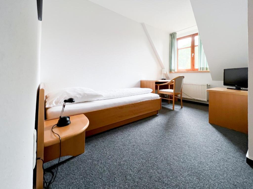 Postel nebo postele na pokoji v ubytování Hotel Hansenhof