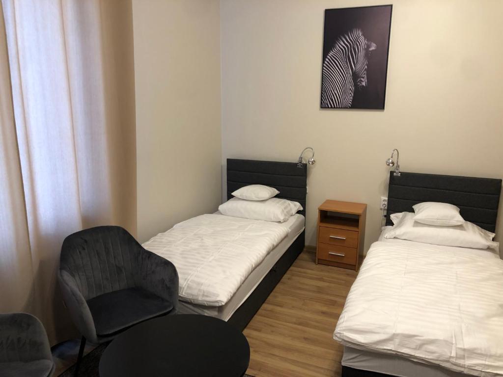 Posteľ alebo postele v izbe v ubytovaní Apartamenty JN Poznań Rzeczna 4