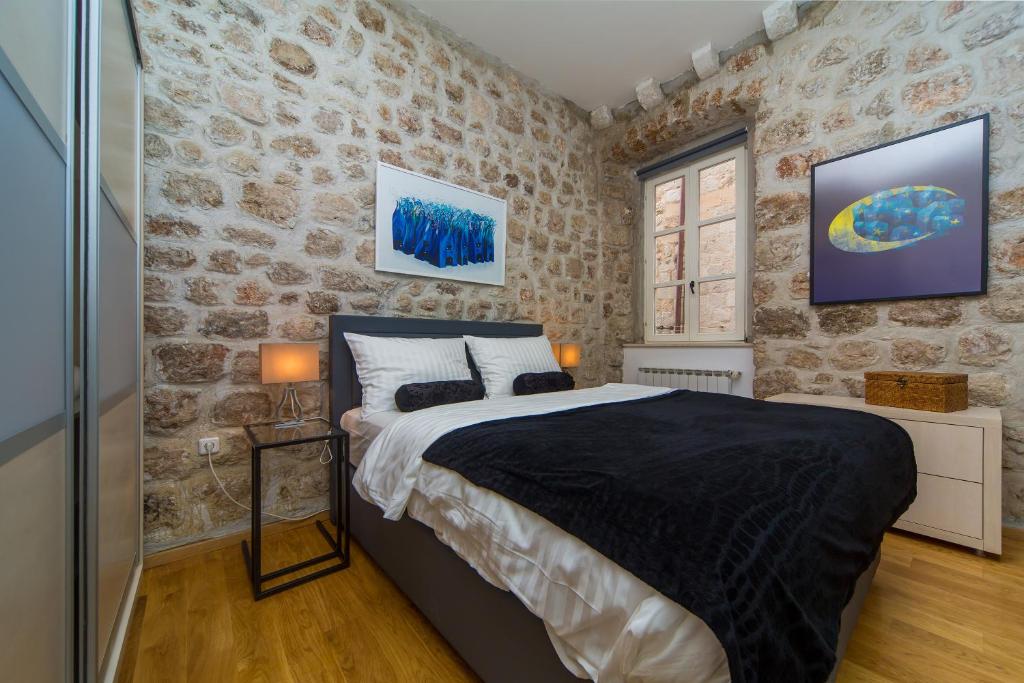 Postel nebo postele na pokoji v ubytování Dubrovnik Dream Apartments