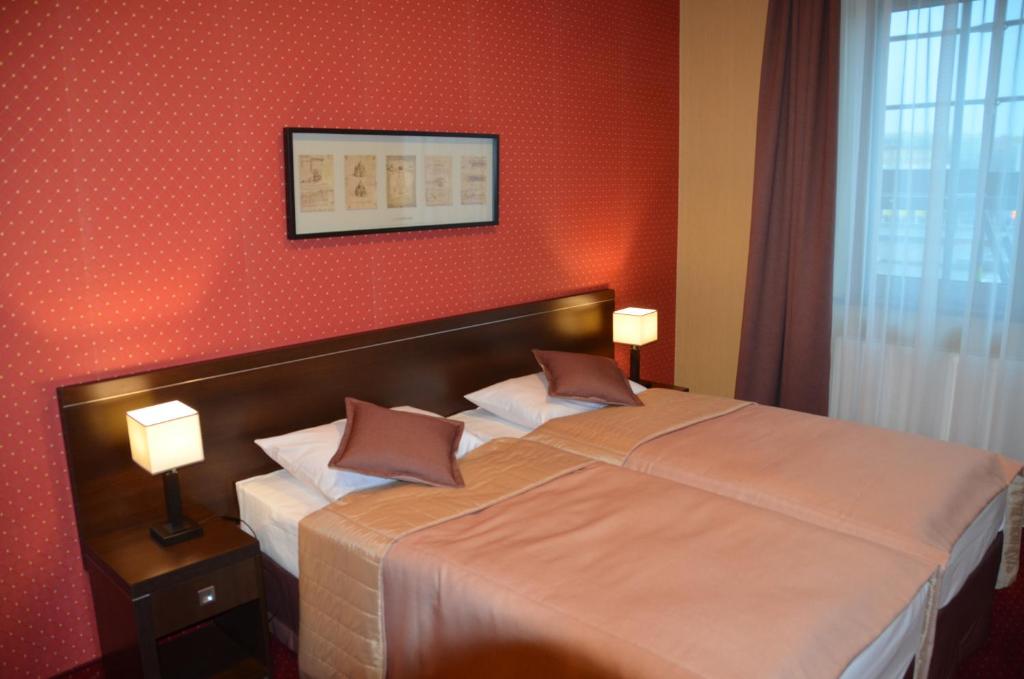 Postel nebo postele na pokoji v ubytování Hotel Pik
