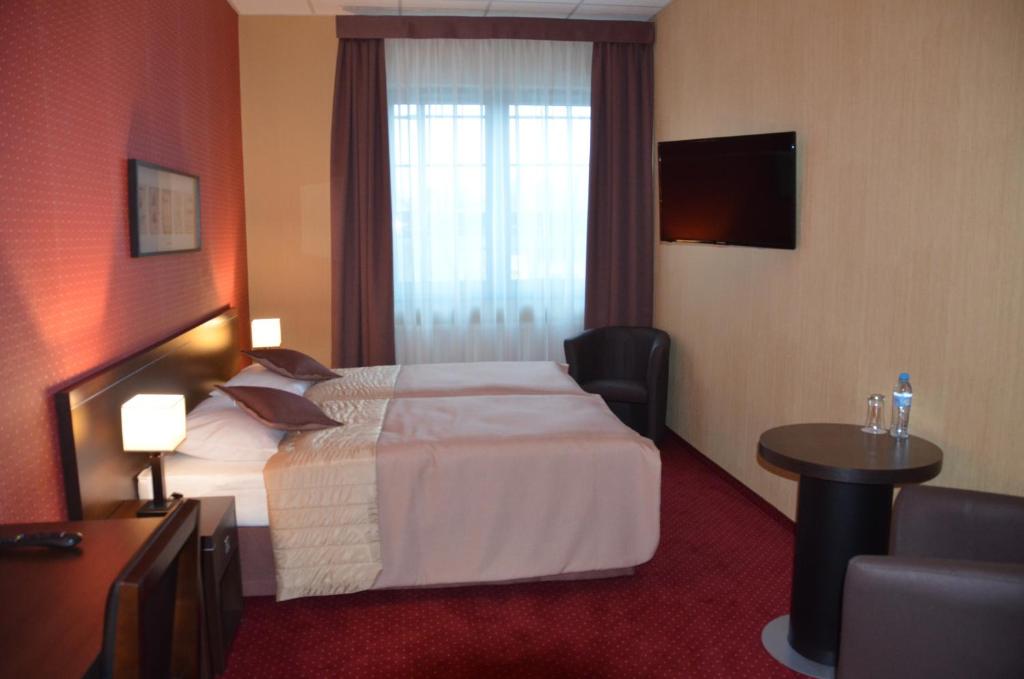 Postel nebo postele na pokoji v ubytování Hotel Pik