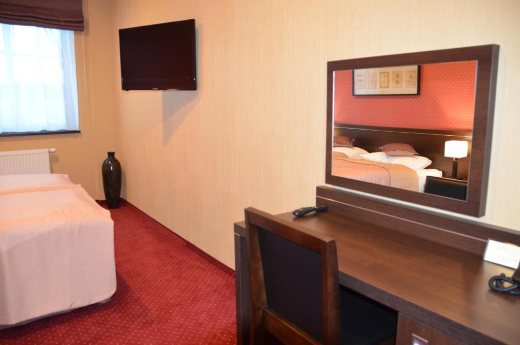 Postel nebo postele na pokoji v ubytování Hotel Pik