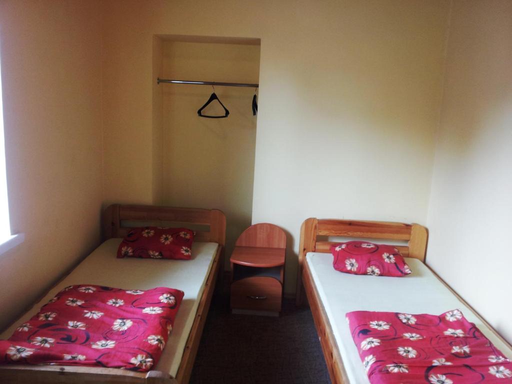 Postel nebo postele na pokoji v ubytování Fortuna Hostel