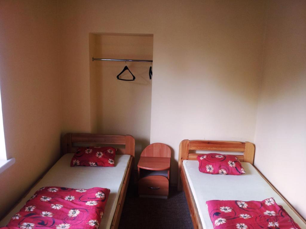Postel nebo postele na pokoji v ubytování Fortuna Hostel