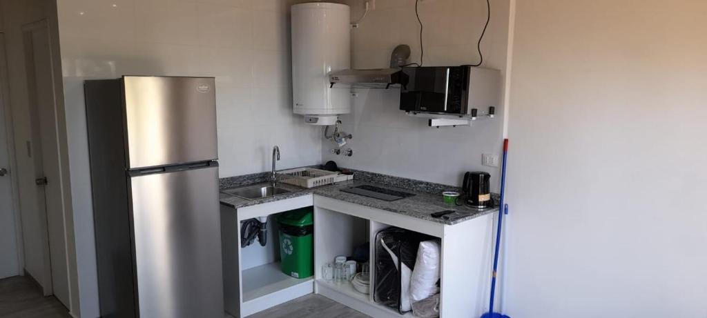 Kuchyň nebo kuchyňský kout v ubytování Departamentos Lipangue