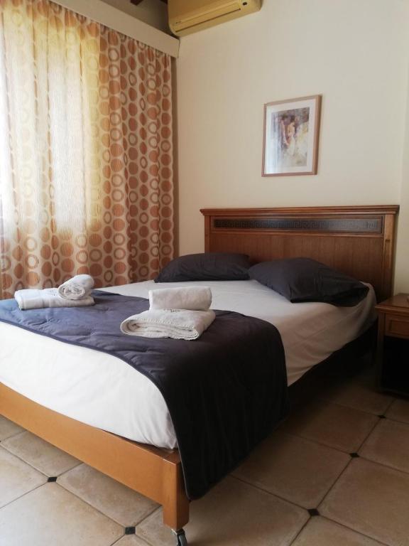 Postel nebo postele na pokoji v ubytování Toxo Hotel
