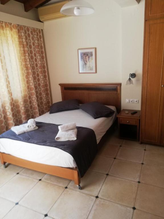 Postel nebo postele na pokoji v ubytování Toxo Hotel