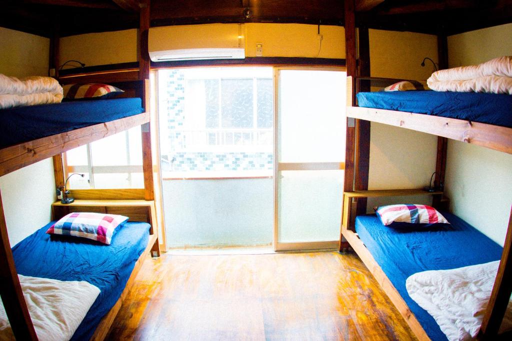 Postel nebo postele na pokoji v ubytování Guesthouse Yadocurly