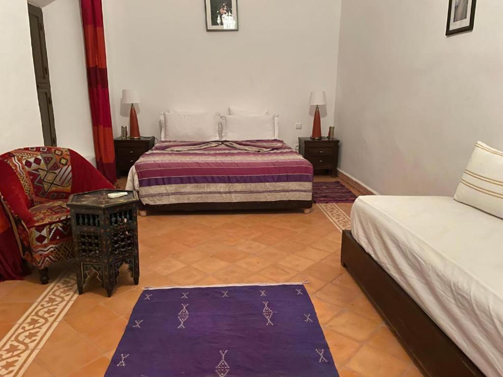Postel nebo postele na pokoji v ubytování Riad Safia