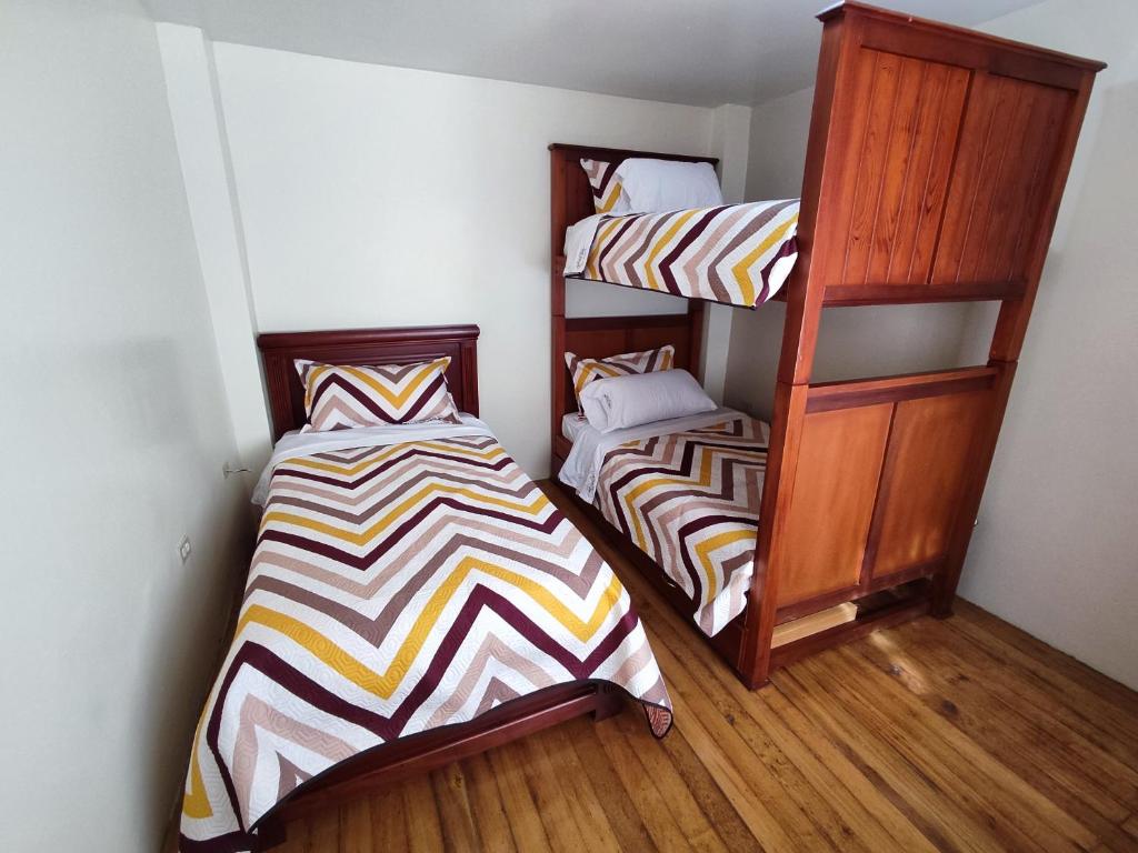 Postel nebo postele na pokoji v ubytování Dulce Hogar 02