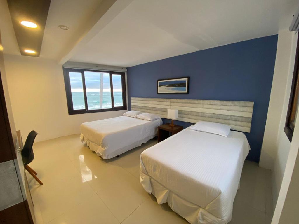 Postel nebo postele na pokoji v ubytování Casita de la Playa