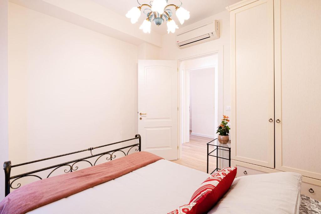 Posteľ alebo postele v izbe v ubytovaní Ricco di comfort, grande, luminoso e comodo