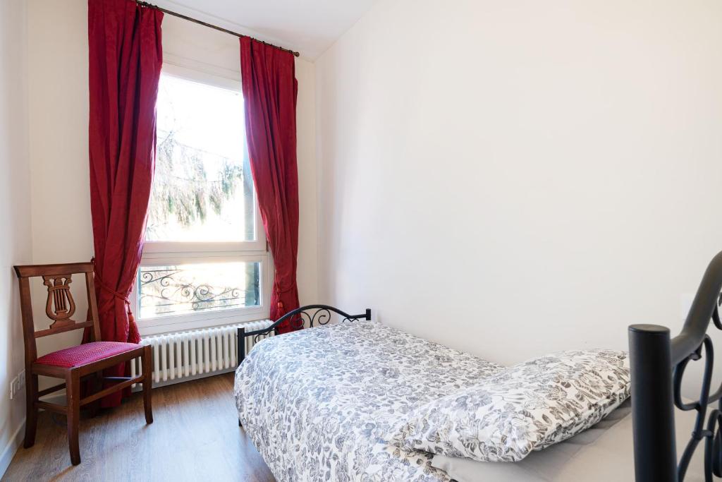 Posteľ alebo postele v izbe v ubytovaní Ricco di comfort, grande, luminoso e comodo