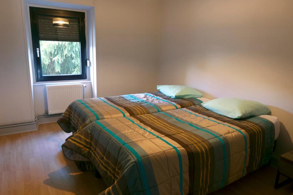 Postel nebo postele na pokoji v ubytování Gîte à La Montagne