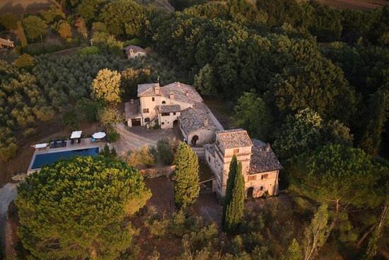 an aerial view of a house in the woods at Casale Alessandri in Massa Martana