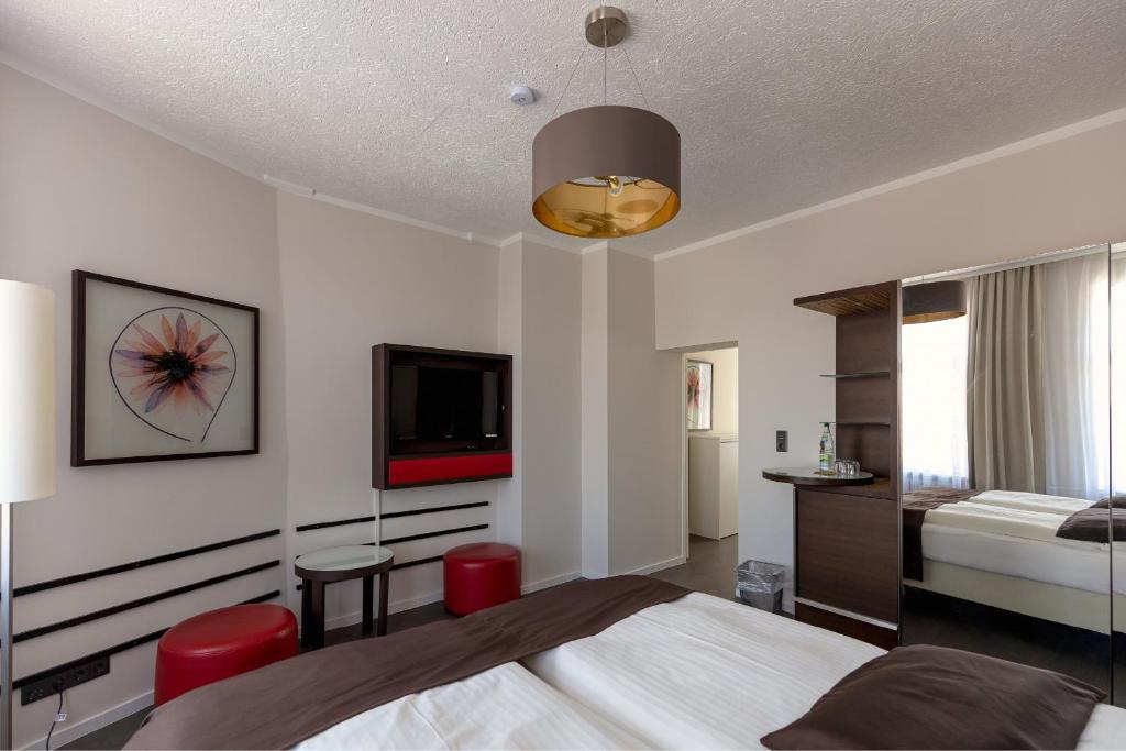 Postel nebo postele na pokoji v ubytování Hotel Garni " Am Domplatz"