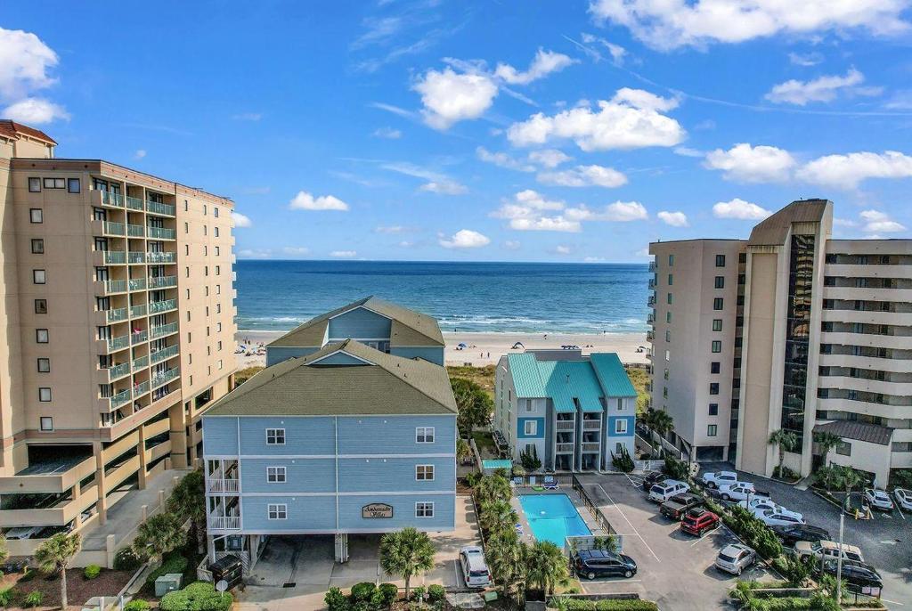 an aerial view of a beach and buildings and the ocean at Stunning 8 BR, New Updates, Walk to Beach Bars, Main Street in Myrtle Beach