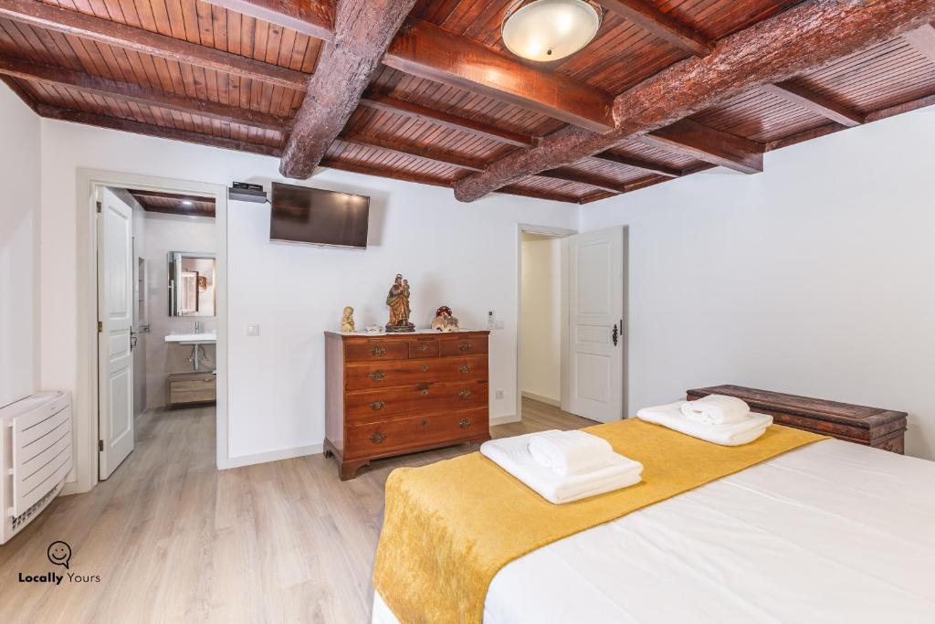 Uma cama ou camas num quarto em Casa do Monte Locally Yours