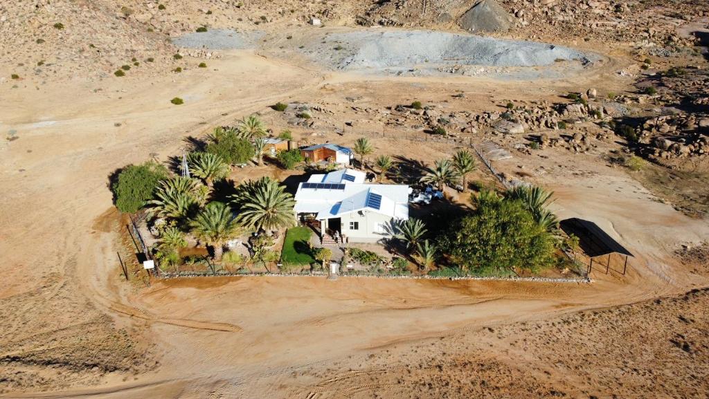 an aerial view of a house in the middle of a desert at Apollis Cottage in Springbok
