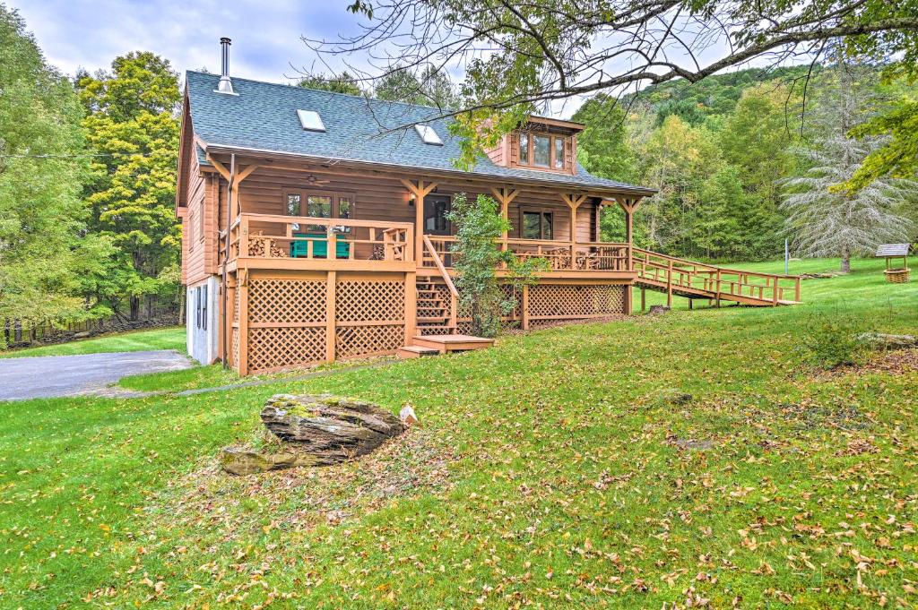 a large wooden house on a grassy field at Log Cabin 9 Mi to Plattekill and Belleayre Mtn in Denver