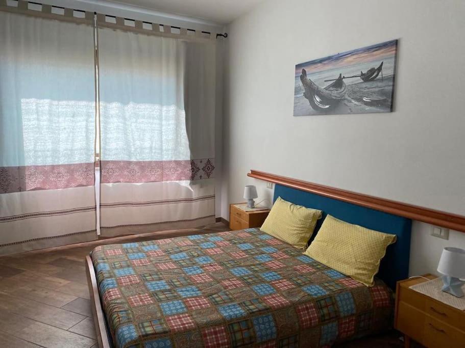 Llit o llits en una habitació de Alloggio con piscina a Sorso 3 kilometri dal mare