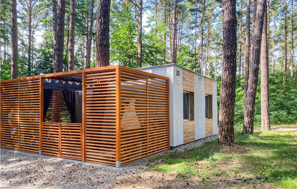 a small wooden house in the woods with trees at 1 Bedroom Stunning Home In Lubniewice in Lubniewice