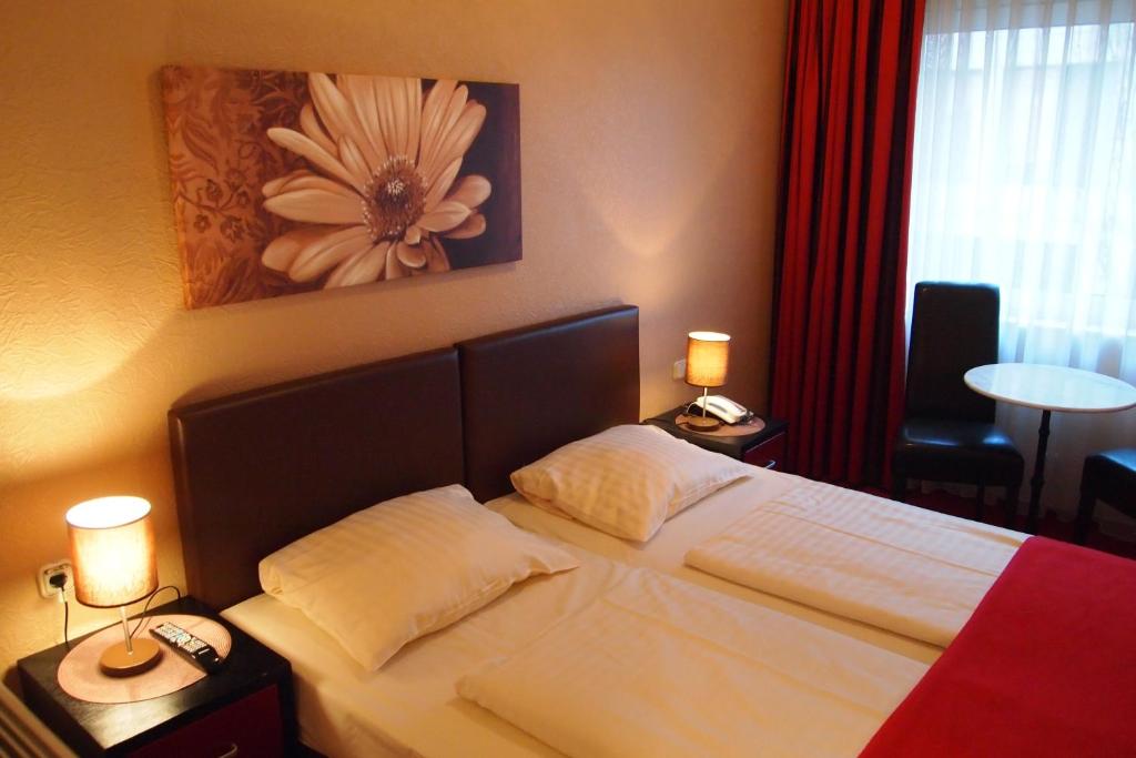 Ein Bett oder Betten in einem Zimmer der Unterkunft Hotel Imperial