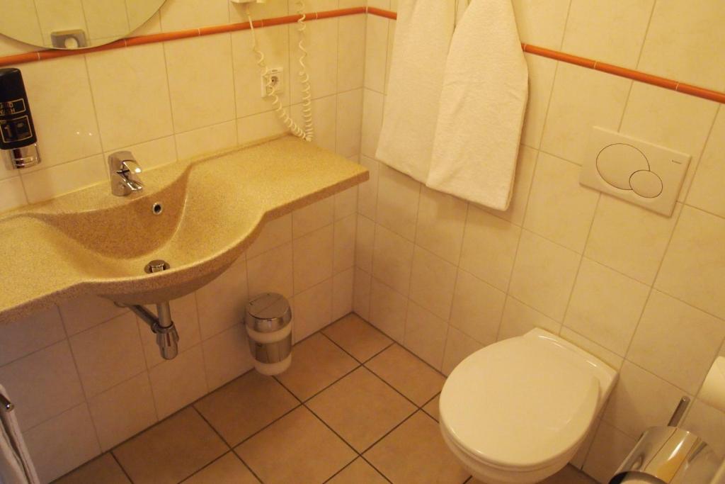 Ein Badezimmer in der Unterkunft Hotel Imperial