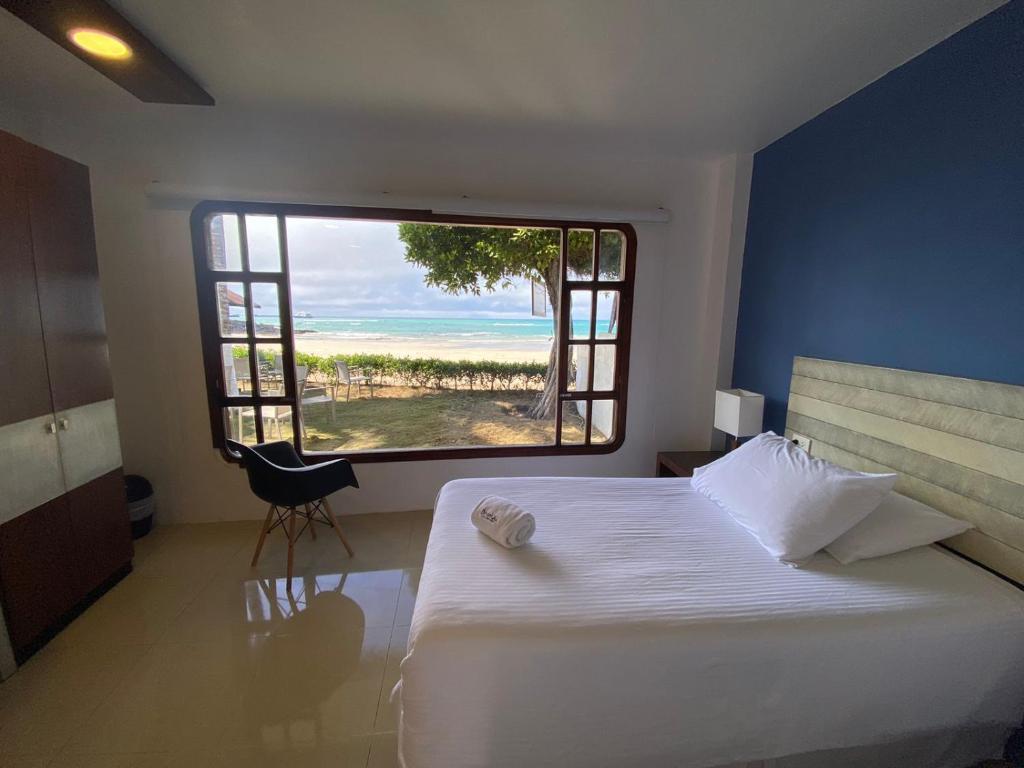 Postel nebo postele na pokoji v ubytování Casita de la Playa
