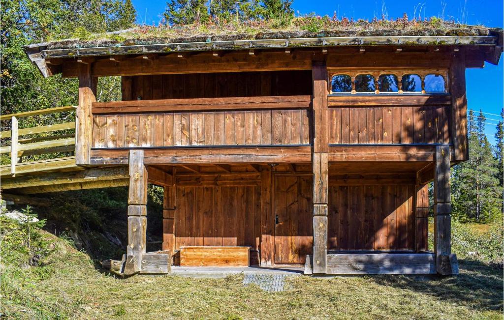 a wooden building with a roof on top of it at Stallen 1 in Rauland