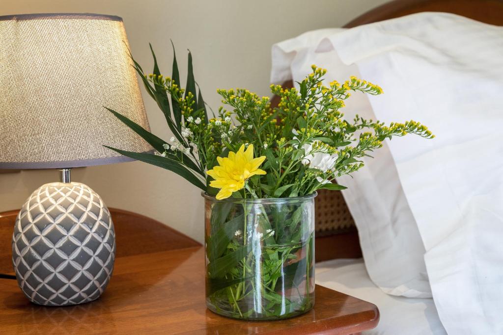 Postel nebo postele na pokoji v ubytování Hotel Palladion