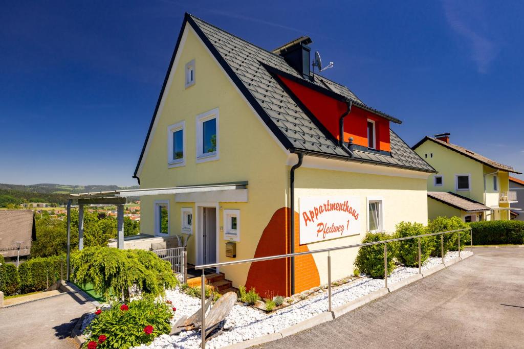 a house with a sign on the side of it at Appartmenthaus Köflach in Köflach