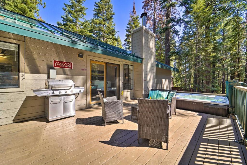 a patio with a grill and a swimming pool at Modern Tahoe City Home Close to Beaches! in Tahoe City