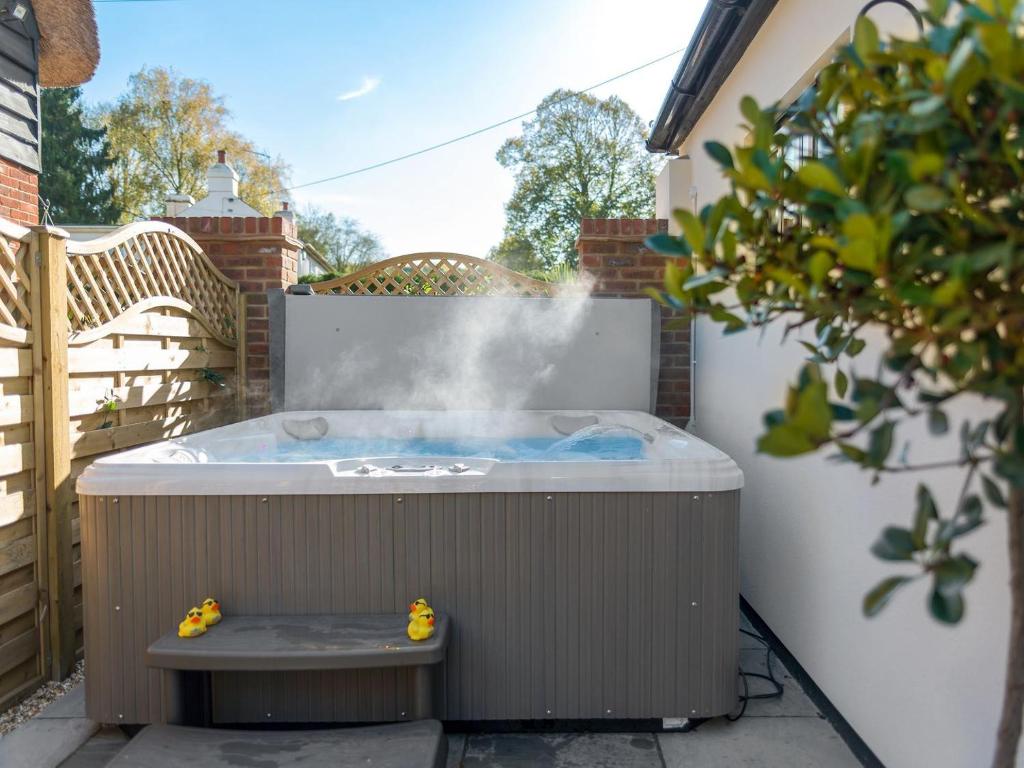 a hot tub with steam coming out of it at The Old Meeting Hall in Kings Somborne