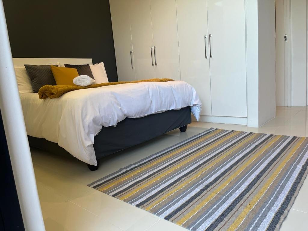 Ένα ή περισσότερα κρεβάτια σε δωμάτιο στο Die Vlei