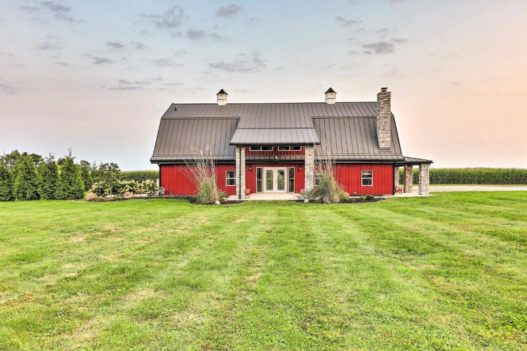 an image of a red barn with a field at Charming Jeffersonville Barndominium with Fire Pit! in Jeffersonville