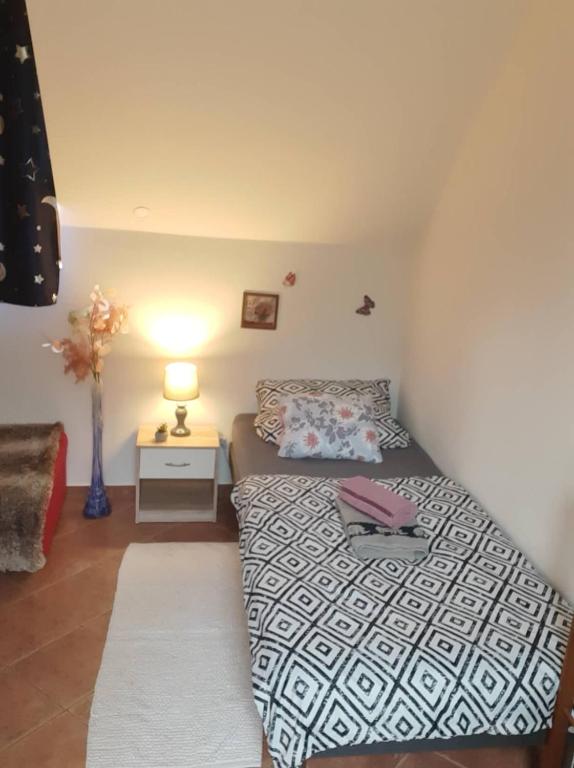 Postel nebo postele na pokoji v ubytování Erdey Apartman