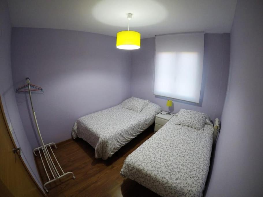 Posteľ alebo postele v izbe v ubytovaní Apartamento Rachel