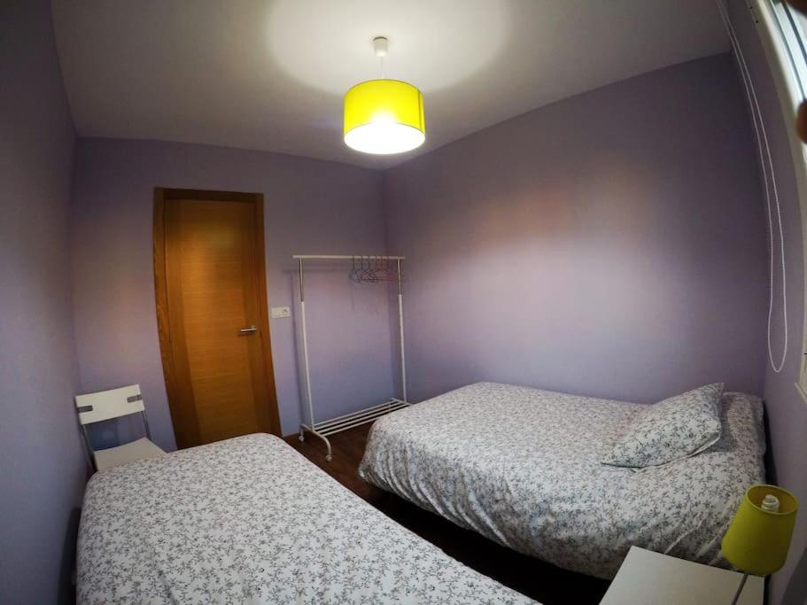 Posteľ alebo postele v izbe v ubytovaní Apartamento Rachel