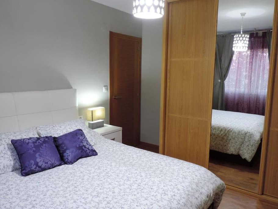Posteľ alebo postele v izbe v ubytovaní Apartamento Rachel
